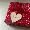 Wooden heart gift tag on a present