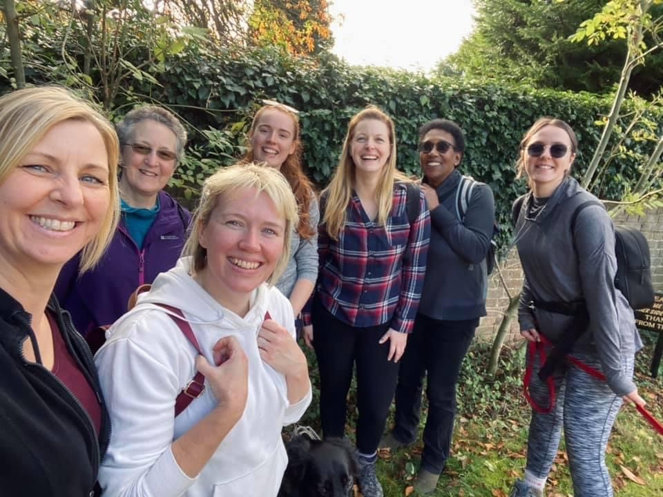 Claire with a group of friends take a selfie on one of their walks
