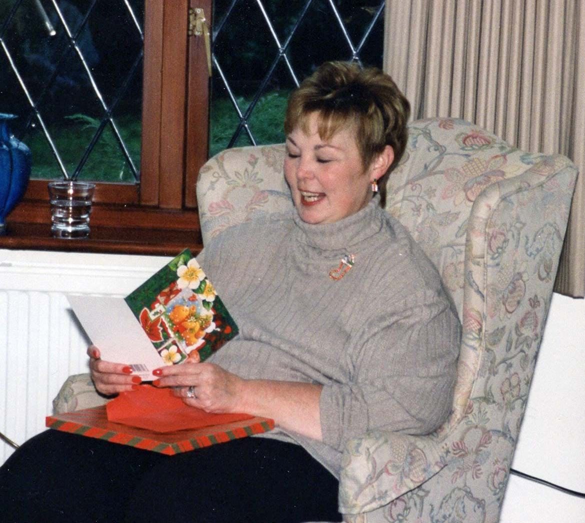 Carolyn sitting in an armchair