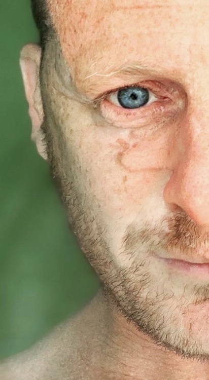 A close-up photograph of one half of a man's face.