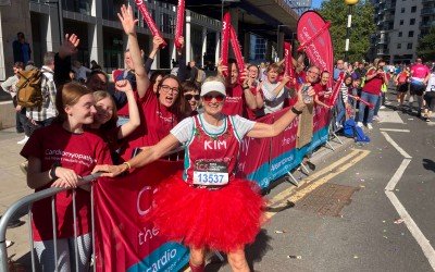 Photo of runner posing at the cheer point