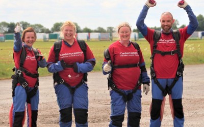 Group of skydivers in Cardiomyopathy UK t-shirts
