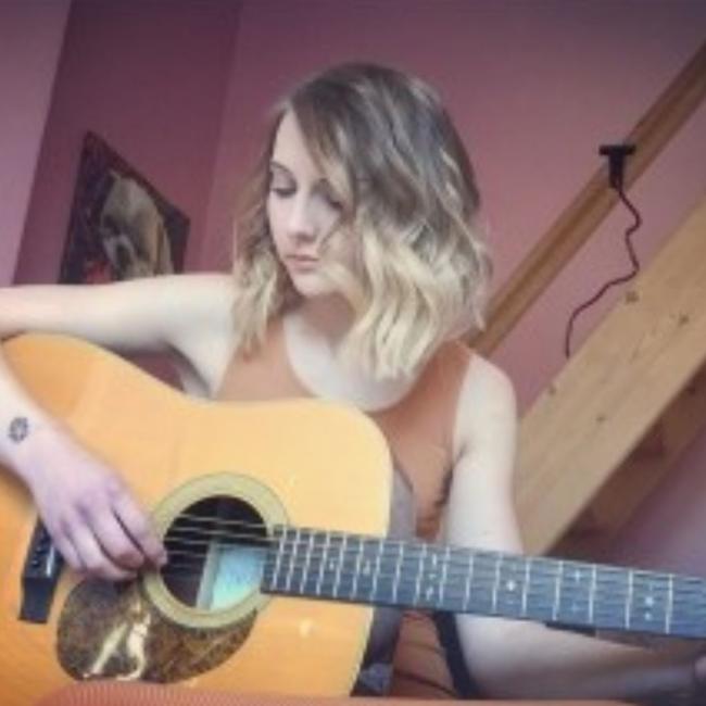 Lisa playing guitar